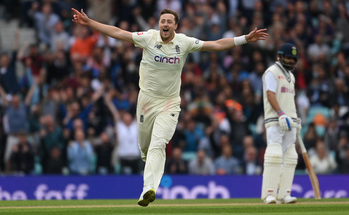 Ollie Robinson celebrates after dismissing Cheteshwar Pujara.