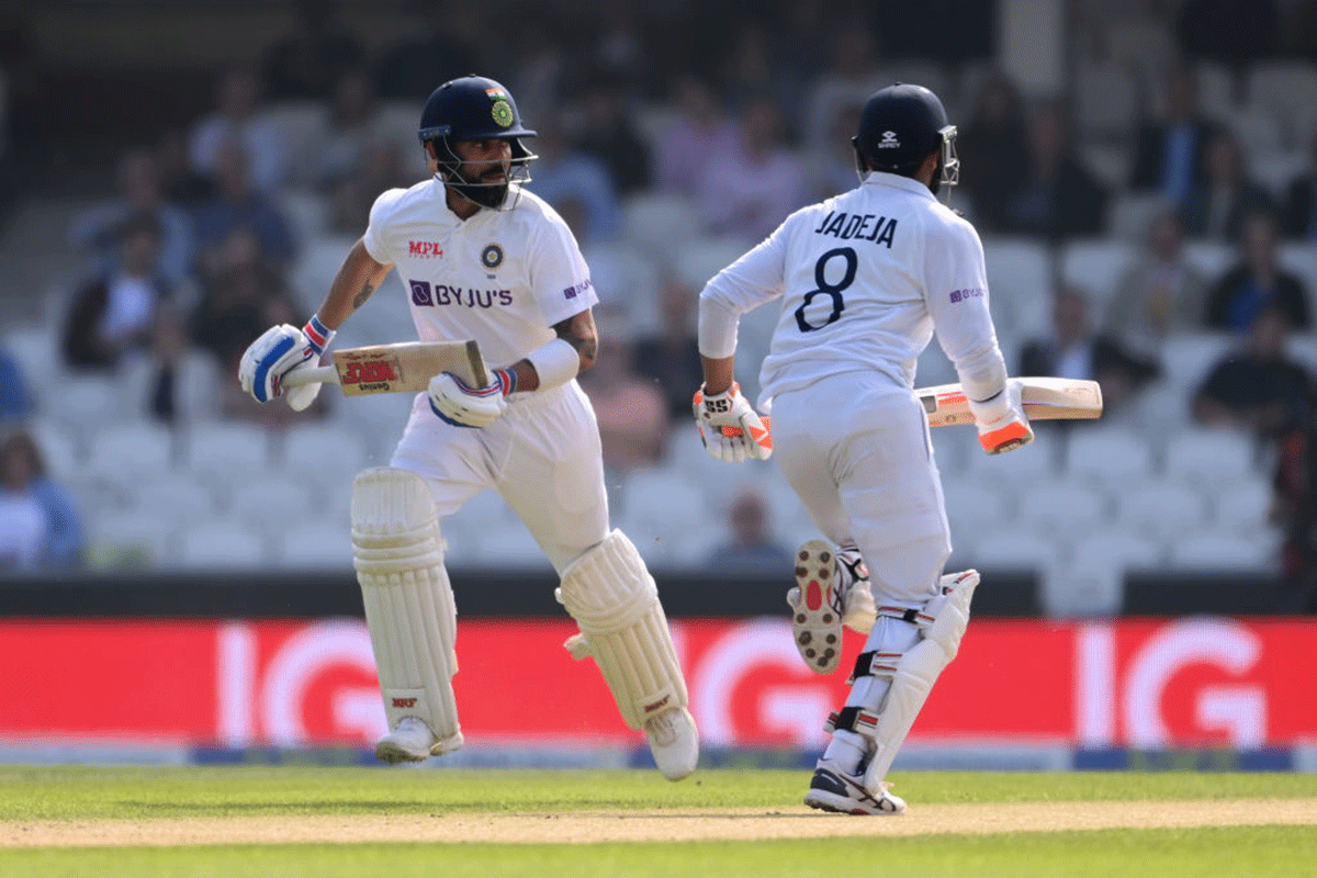 India's Virat Kohli and Ravindra Jadeja take a quick single during the morning session on Day 4 of the fourth Test against England, at The Kia Oval in London, on Sunday.