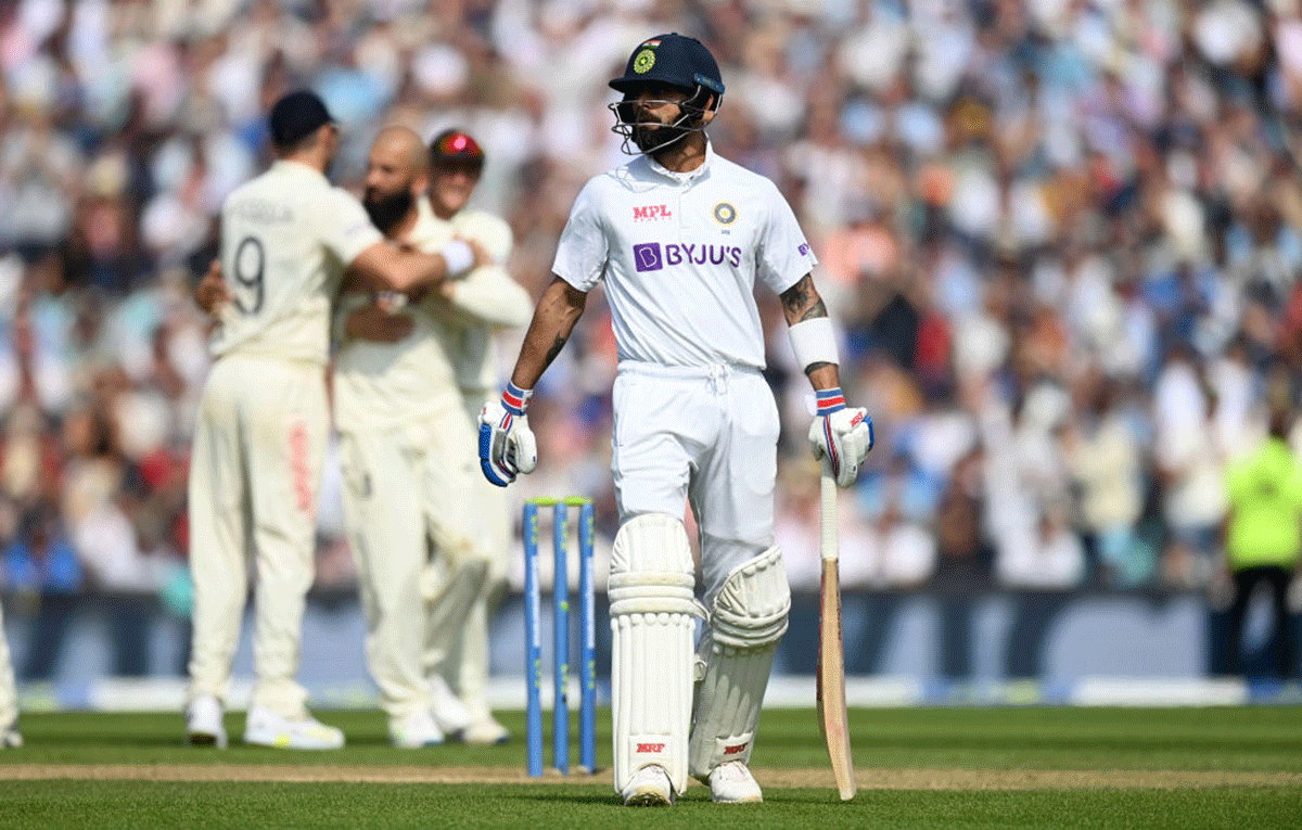 Virat Kohli leaves the field after being dismissed by Moeen Ali