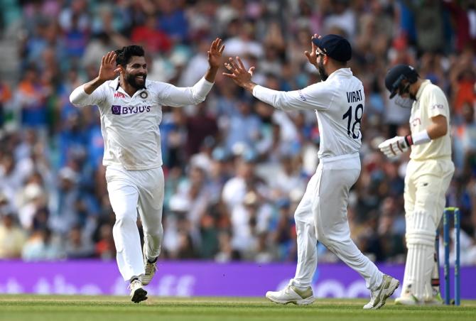 Ravindra Jadeja celebrates with captain Virat Kohli after dismissing Moeen Ali.