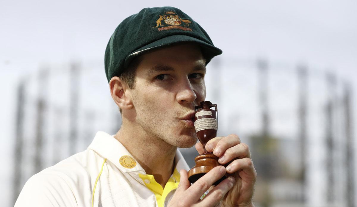 Tim Paine celebrates with the Urn after Australia draw the series to retain the Ashes during Day 4 of the fifth Test against England, at The Kia Oval in London, on September 15, 2019.