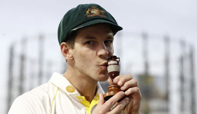 Tim Paine celebrates with the Urn after Australia draw the series to retain the Ashes during Day 4 of the fifth Test against England, at The Kia Oval in London, on September 15, 2019.