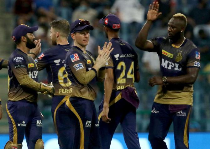 Kolkata Knight Riders players celebrate the wicket of Devdutt Padikkal.