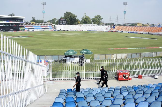 Members of the Police Elite Force inspect an enclosure at the Rawalpindi Cricket Stadium, on September 17, 2021, after the New Zealand cricket team pulled out of their Pakistan tour over security concerns.
