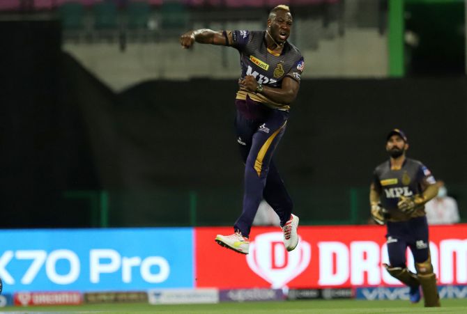 Andre Russell celebrates the wicket of AB de Villiers