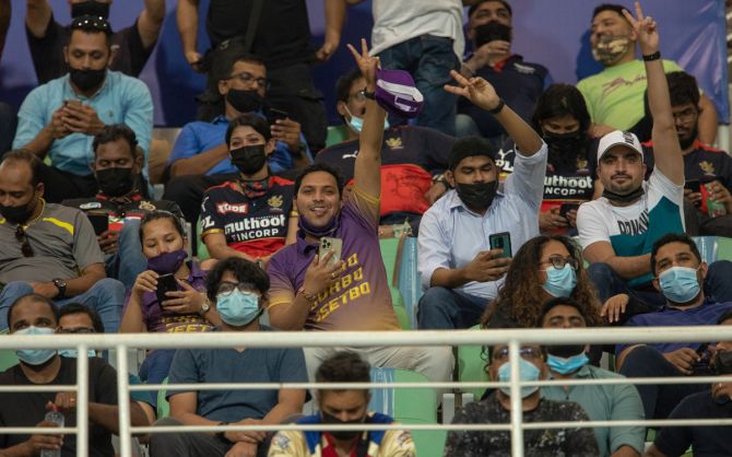 Cricket fans during the Vivo Indian Premier League match between the Kolkata Knight Riders and Royal Challengers Bangalore, at the Sheikh Zayed Stadium, in Abu Dhabi, on Monday.