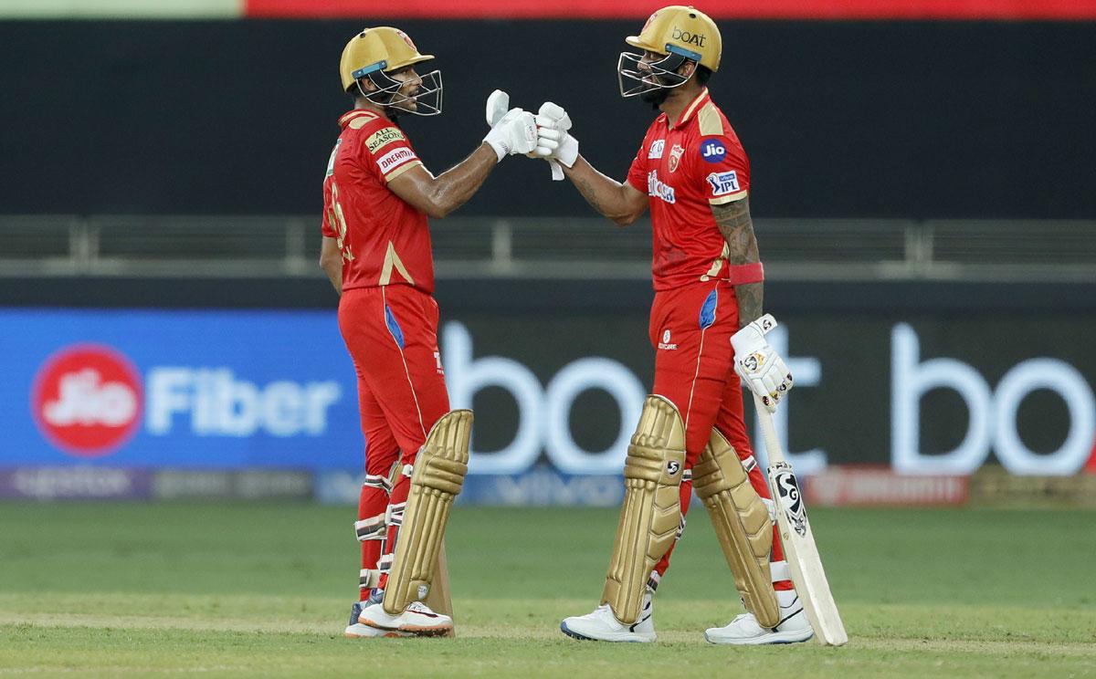 Mayank Agarwal and K L Rahul celebrate a boundary during their partnership.