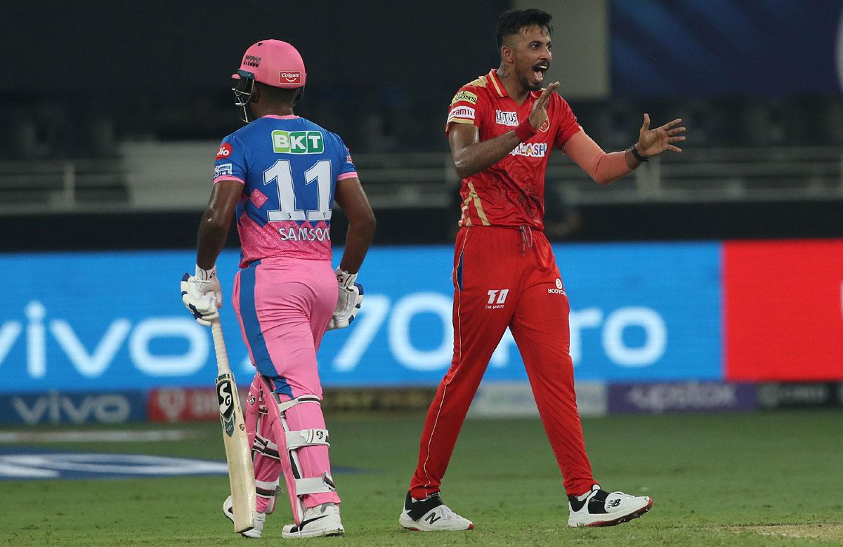 Ishan Porel celebrates the wicket of Sanju Samson.