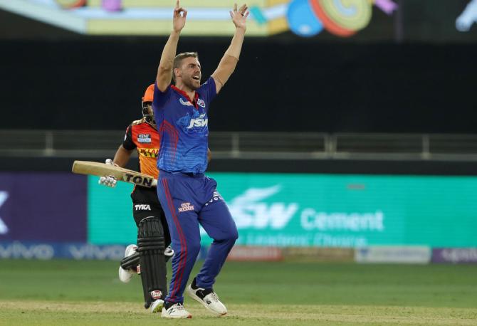 Anrich Nortje celebrates the wicket of Kedar Jadhav.