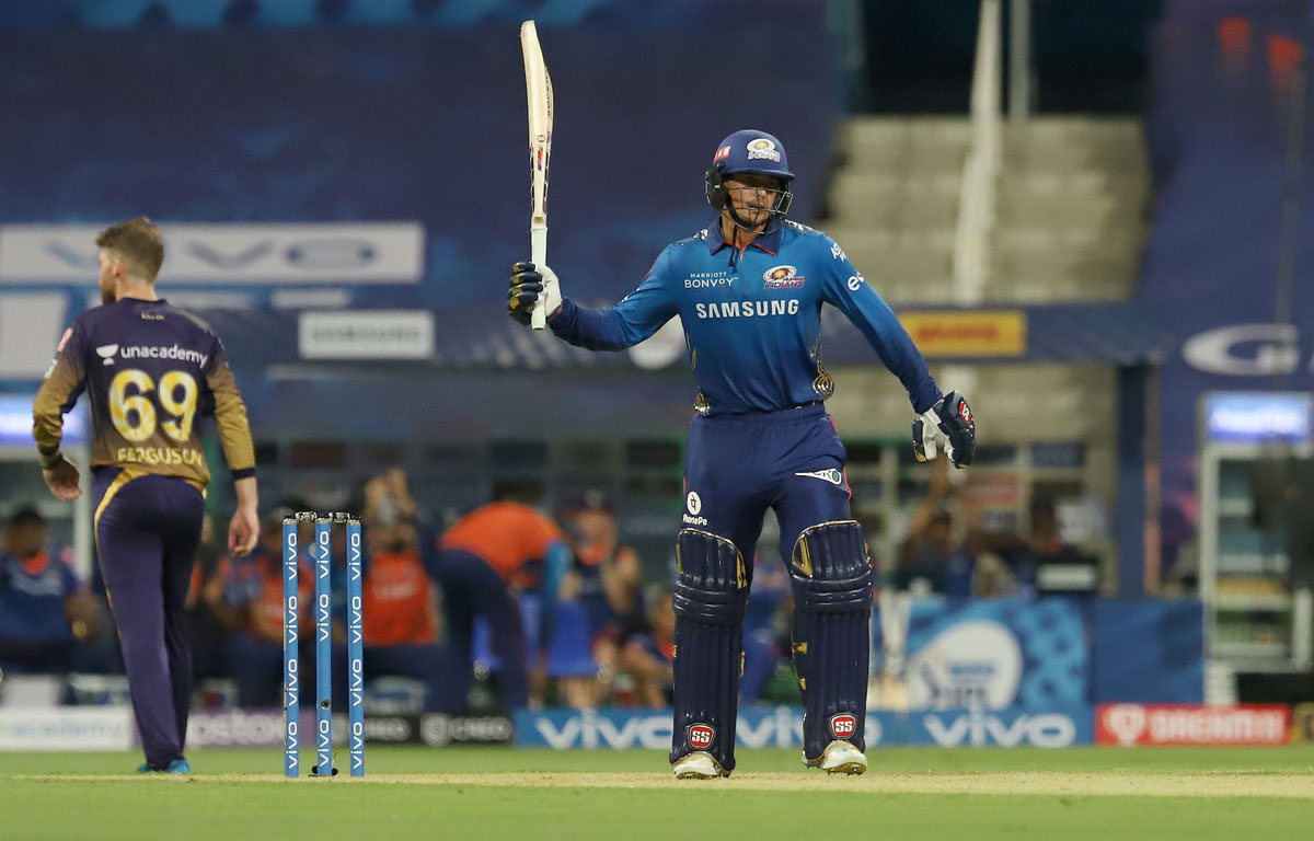 Quinton de Kock waves to the stands after scoring 50.