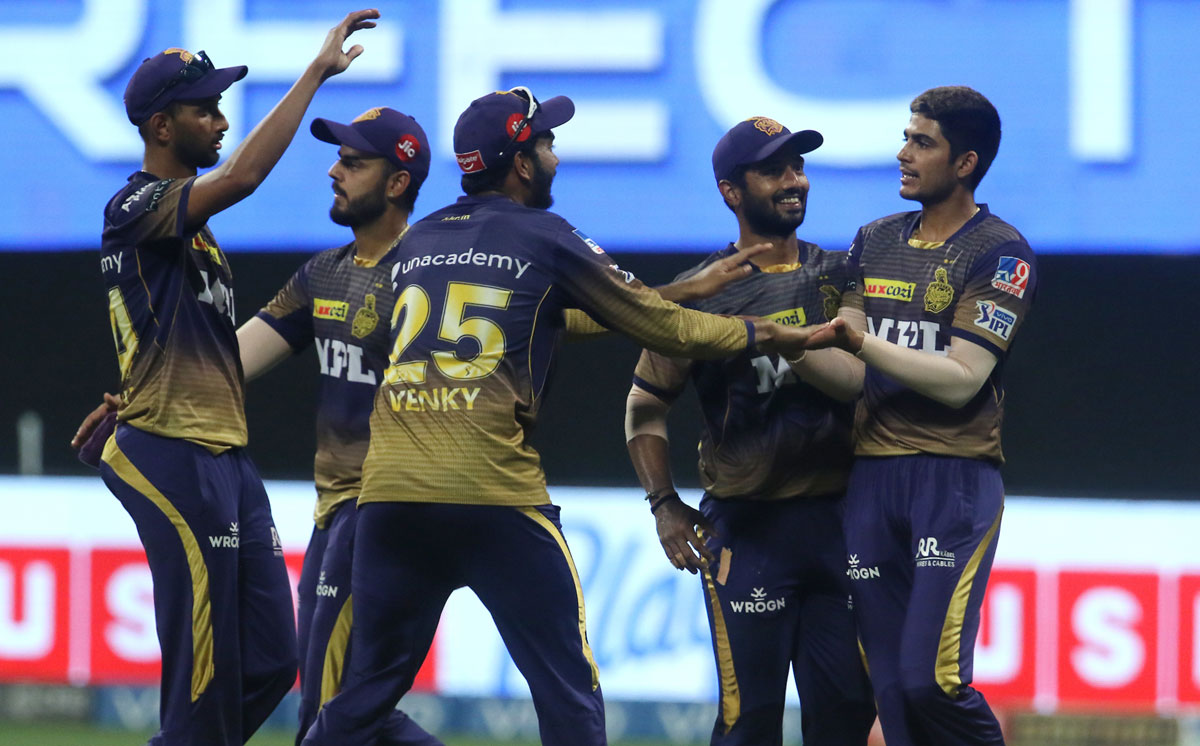 Kolkata Knight Riders players celebrate the wicket of Rohit Sharma.