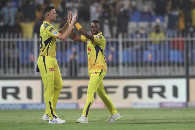 Chennai Super Kings pacer Dwayne Bravo celebrates with Josh Hazlewood after dismissing Virat Kohli.