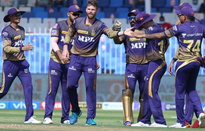 Kolkata Knight Riders pacer Lockie Ferguson celebrates with teammates after dismissing Delhi Capitals opener Shikhar Dhawan in the Indian Premier League match, in Sharjah, on Tuesday.
