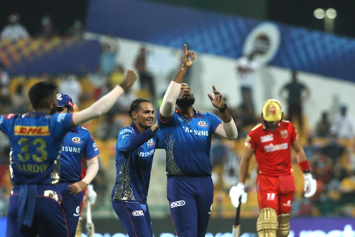 Kieron Pollard celebrates with his Mumbai Indians teammates after taking the wicket of K L Rahul.