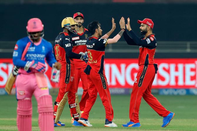 Yuzvendra Chahal is congratulated by skipper Virat Kohli after dismissing Mahipal Lomror.