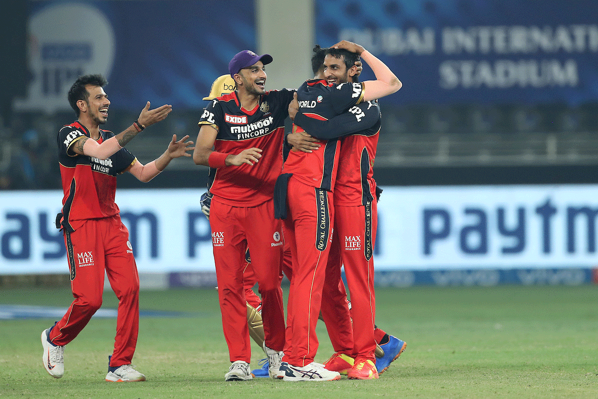 RCB players celebrate with Shahbaz Ahmed after he dismissed Sanju Samson