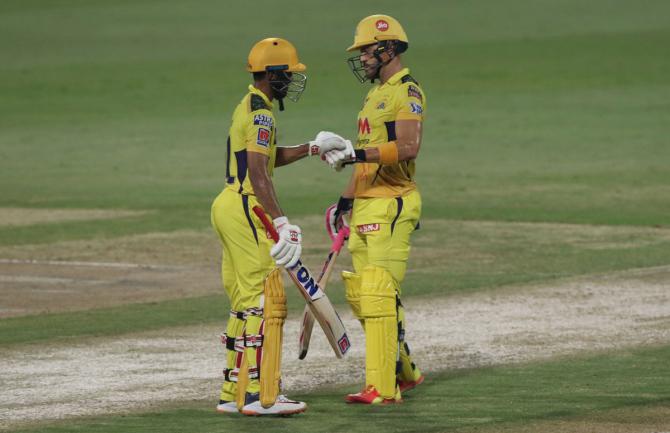 Faf du Plessis and Ruturaj Gaikwad celebrate a boundary.