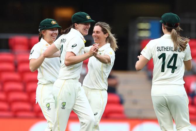 Sophie Molineux celebrates with team mates after dismissing Shafali Verma.