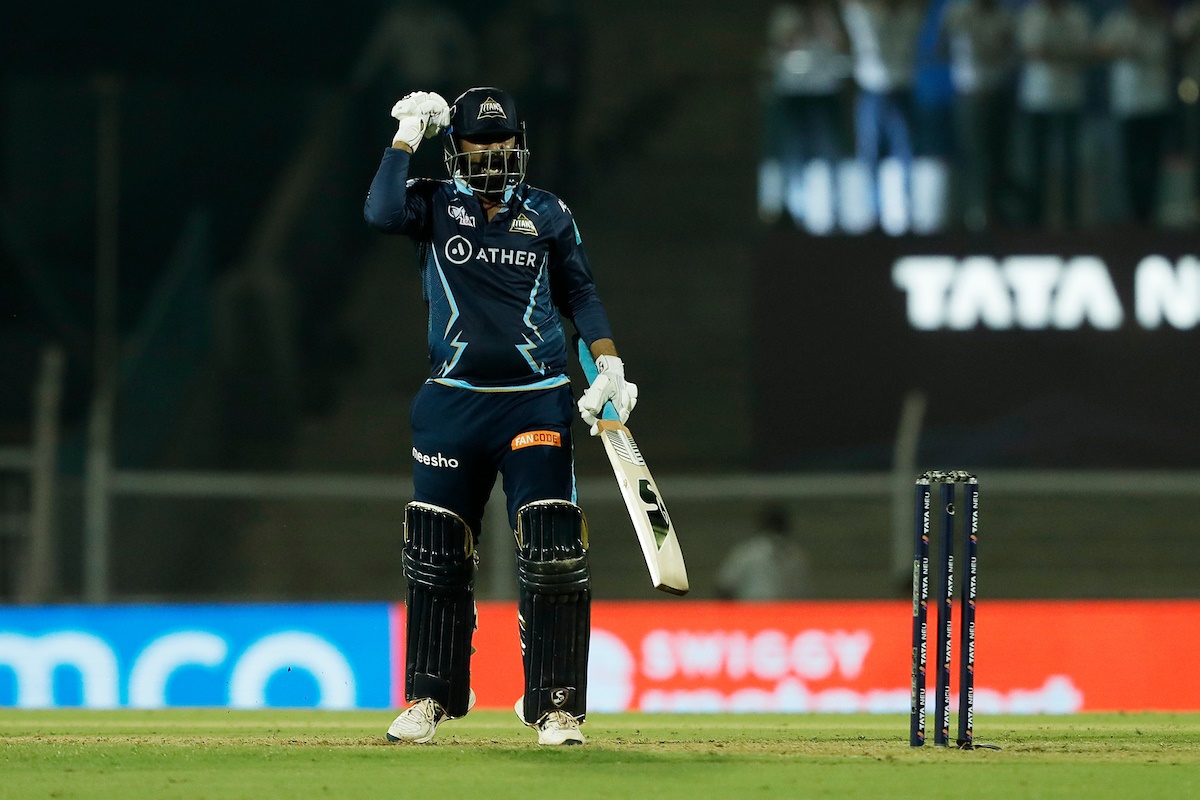 Rahul Tewatia celebrates after taking Gujarat Titans past Punjab Kings in a thrilling finish in the IPL match, at the Brabourne Stadium in Mumbai, on Friday.