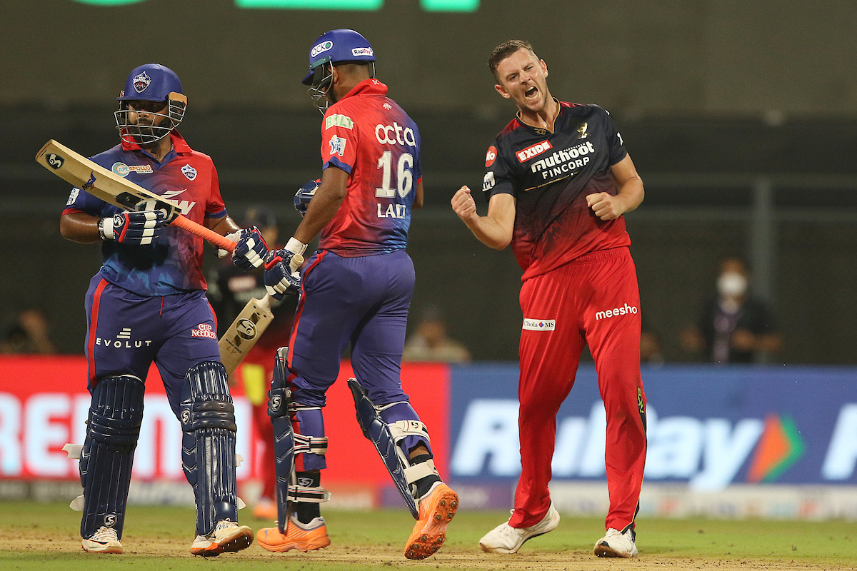 Royal Challengers Bangalore pacer celebrates Josh Hazlewood celebrates dismissing Delhi Capitals batter Lalit Yadav during the Indian Premier League match, at the Wankhede stadium in Mumbai, on Saturday.