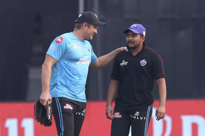 Delhi Capitals assistant coach Shane Watson pacifies Prithvi Shaw after the 15-run defeat to Rajasthan Royals in the IPL match at the Wankhede Stadium in Mumbai on Friday.