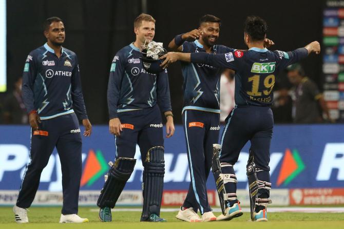 Gujarat Titans' captain Hardik Pandya celebrates with Rashid Khan who took them over the line against Surisers Hyderabad on Thursday