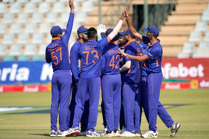 India's players celebrate the wicket of Sikandar Raza