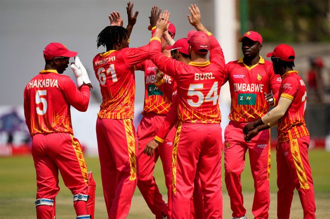 Zimbabwe's players celebrate the dismissal of Shikhar Dhawan