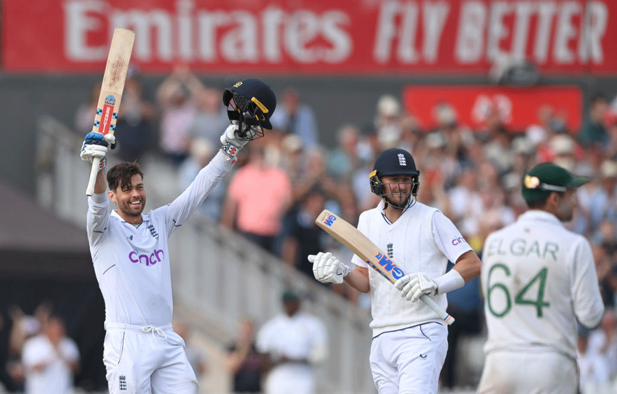 England's Ben Foakes celebrates his century as Ollie Robinson applauds 