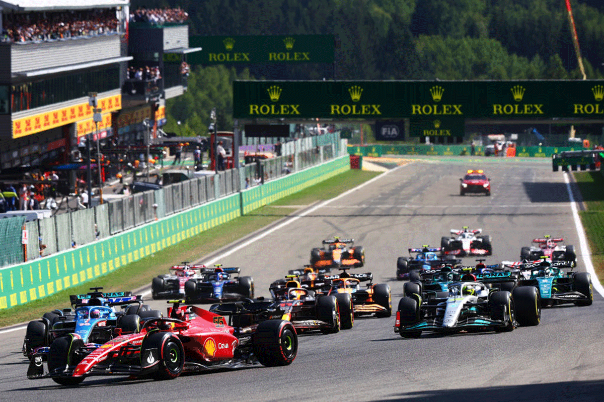 Carlos Sainz of Spain driving (55) the Ferrari F1-75 leads the field into turn one at the start of the F1 Grand Prix of Belgium