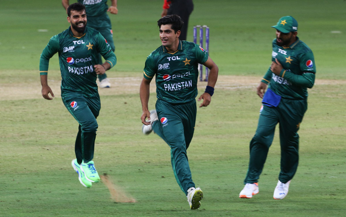 Pakistan's Naseem Shah celebrates with teammates after taking the wicket of India's KL Rahul. 