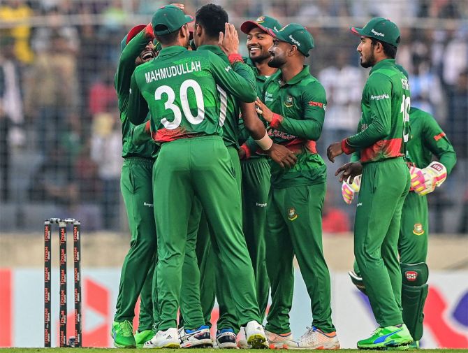 Bangladesh's players celebrate a wicket during the second ODI against India. 