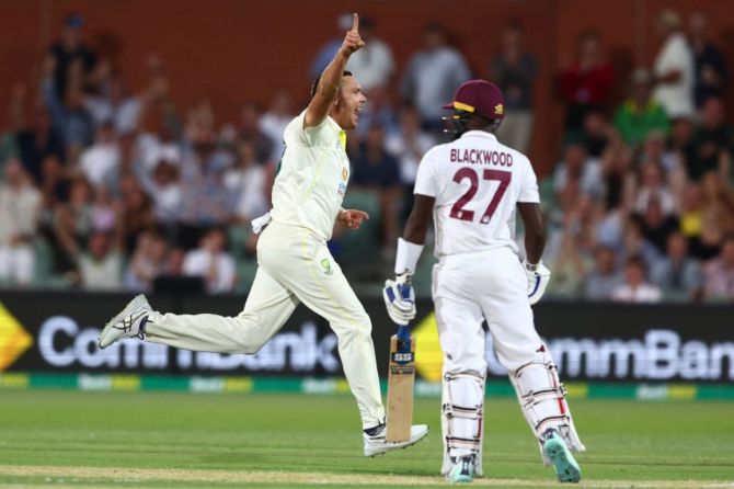 Australia's Scott Boland celebrates the wicket of west Indies' Jermaine Blackwood