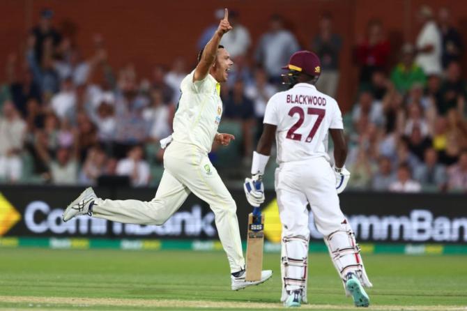 Australia's Scott Boland celebrates the wicket of west Indies' Jermaine Blackwood