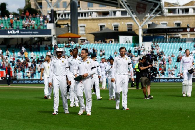 South Africa's Dean Elgar and teammates walk off the pitch after the match