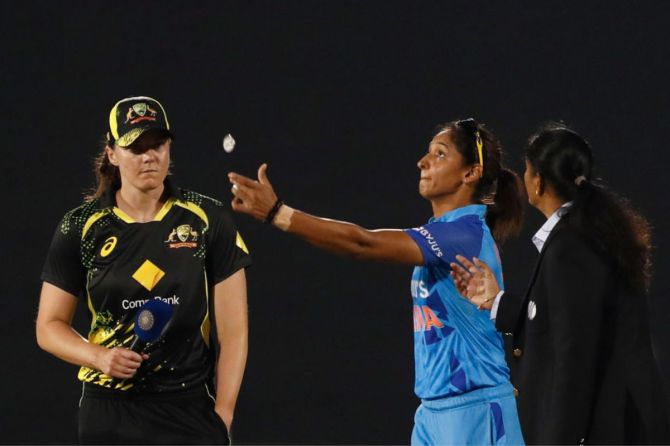 Australia's Tahlia McGrath (c) and India's Harmanpreet Kaur (C) at the toss during the T20 International series between India and Australia at Brabourne Stadium
