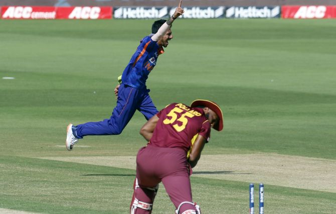 Yuzvendra Chahal celebrates the wicket of West Indies captain Kieron Pollard.