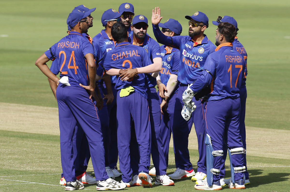 Yuzvendra Chahal celebrates with teammates after dismissing Nicholas Pooran.