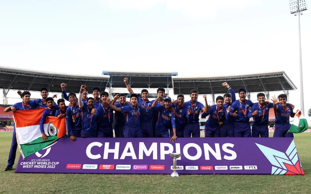 The triumphant India team celebrates with the trophy after winning the Under-19 World Cup in Antigua on Saturday. 