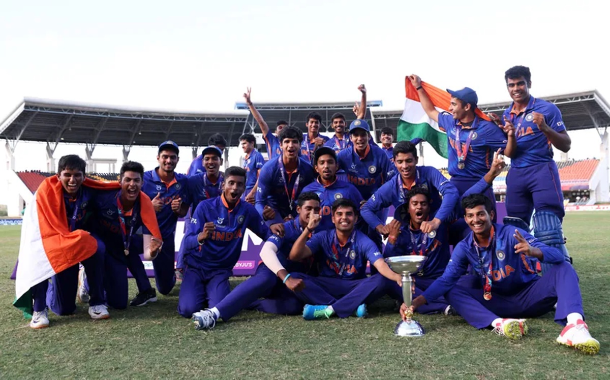 India's players celebrate with trophy and tricolour after defeating England in the final of the ICC Under-19 men's World Cup, at Sir Vivian Richards Stadium in Antigua, on Saturday