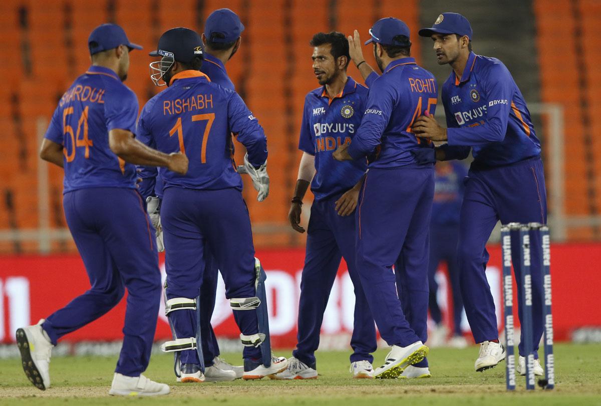 Yuzvendra Chahal celebrates with teammates after dismissing Shai Hope.