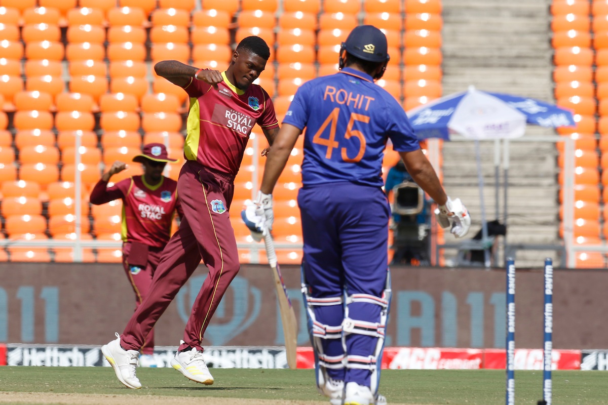 West Indies pacer Alzarri Joseph celebrates after dismissing  India skipper Rohit Sharma.