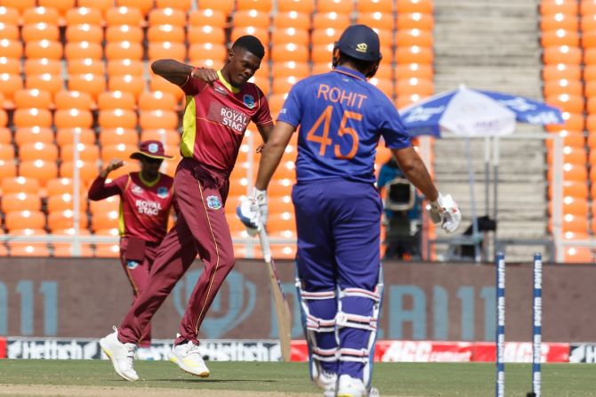 West Indies pacer Alzarri Joseph celebrates after dismissing  India skipper Rohit Sharma.
