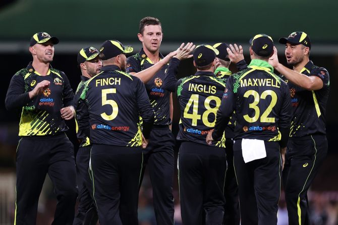 Josh Hazlewood celebrates with his Australia teammates after taking the wicket of Sri Lanka's Avishka Fernando during Game 2 of the T20 International series, at Sydney Cricket Ground, on Sunday.