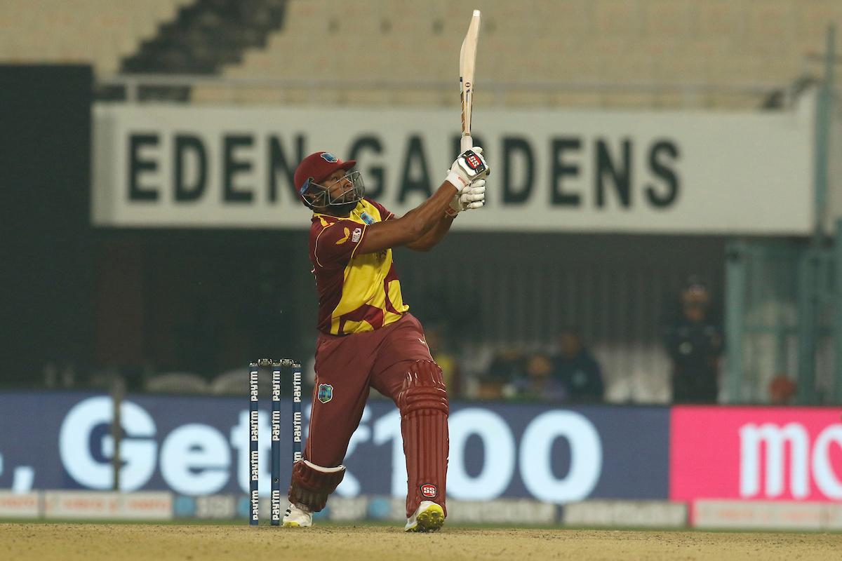 Kieron Pollard hits a six during his 19-ball 24.