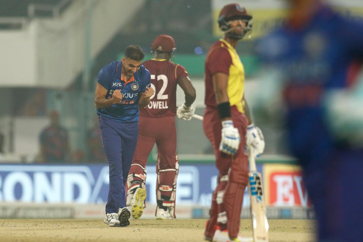 Harshal Patel celebrates the wicket of Rovman Powell.