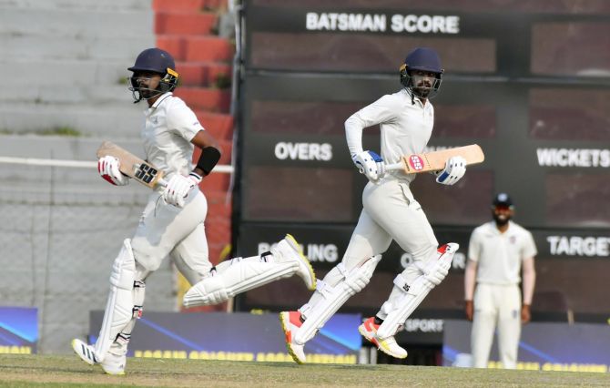 Tamil Nadu's Baba Aparajith and Babba Indrajith run between the wickets during their 207-run partnership on Day 1 of the Ranji Trophy match against Chhattisgarh, at Nehru Stadium in Guwahati on Thursday. 