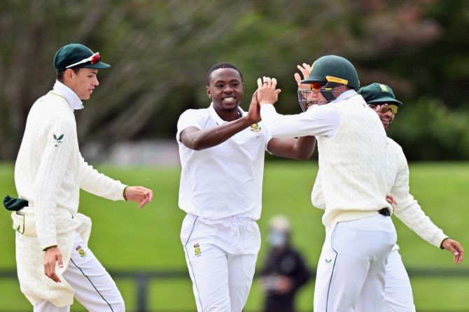 South Africa pacer Kagiso Rabada is congratulated by teammates after dismissing New Zealand's Tom Latham during Day 2 of the second Test, at Hagley Oval in Christchurch, on Saturday.