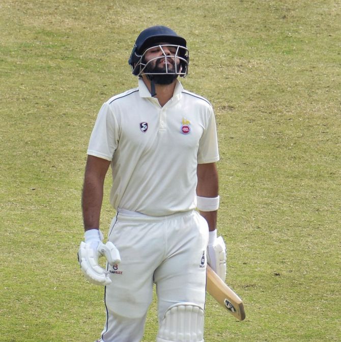 Delhi batter Dhruv Shorey reacts after being dismissed for 136 off 177 balls on Day 4 of the Ranji Trophy match against Jharkhand, at Barsapara Cricket Stadium, in Guwahati, on Sunday.