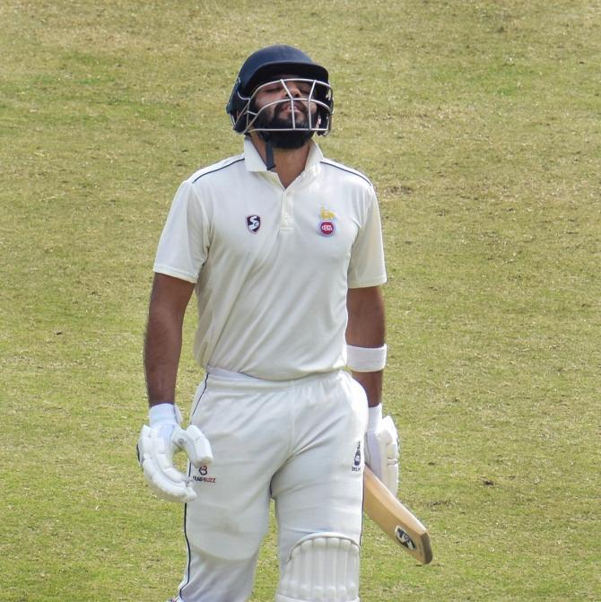 Delhi batter Dhruv Shorey reacts after being dismissed for 136 off 177 balls on Day 4 of the Ranji Trophy match against Jharkhand, at Barsapara Cricket Stadium, in Guwahati, on Sunday.